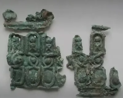 Folded copper/brass piece (decorated) — Oak Island artifact