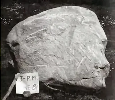 Head Stone (human face/sword)