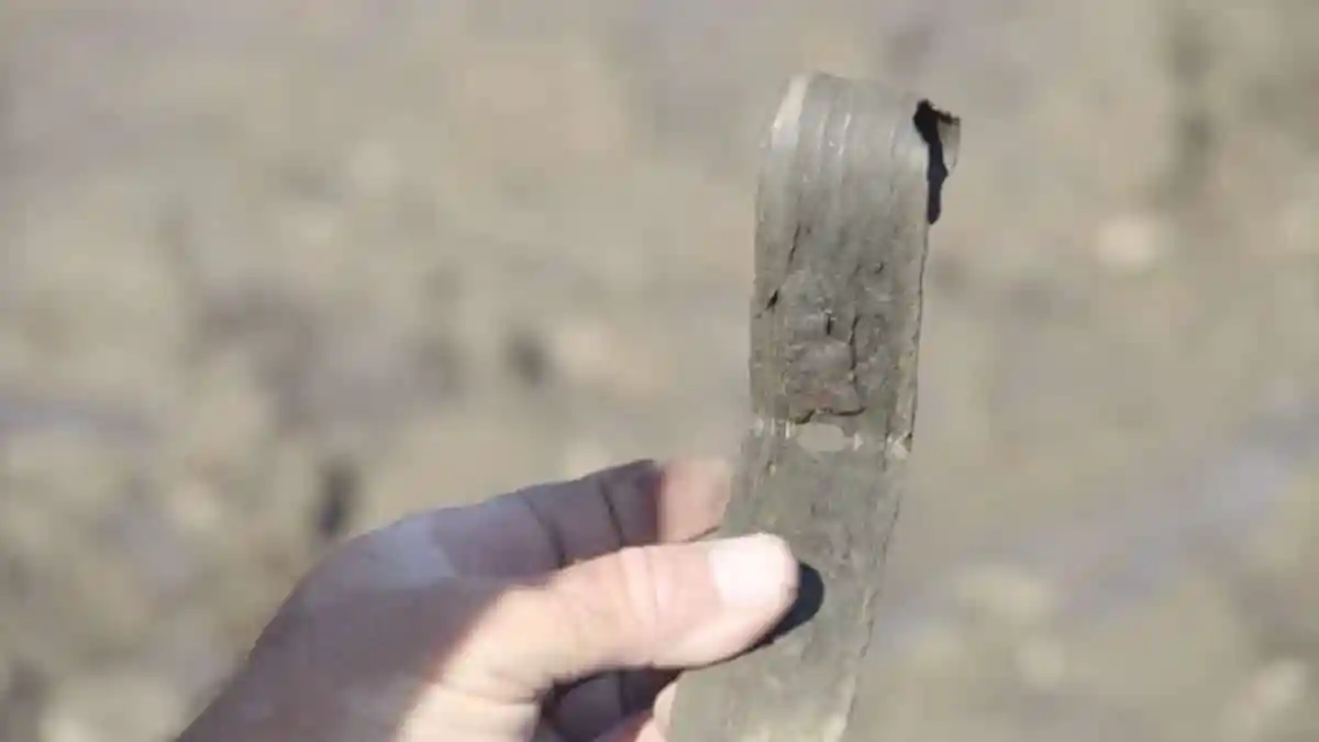 Iron hinge (massive) — colonial artifact. found at Smith's Cove, Oak Island. Dated: Pre-1800; possibly early 1600s