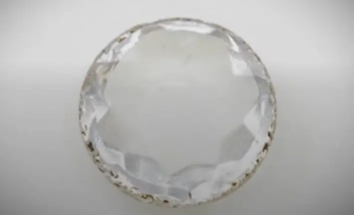 Ornate Facted Glass Jewel — colonial artifact. found at Lot 5 Stone Feature, Oak Island. Dated: Early to mid-1700s (post-1734)