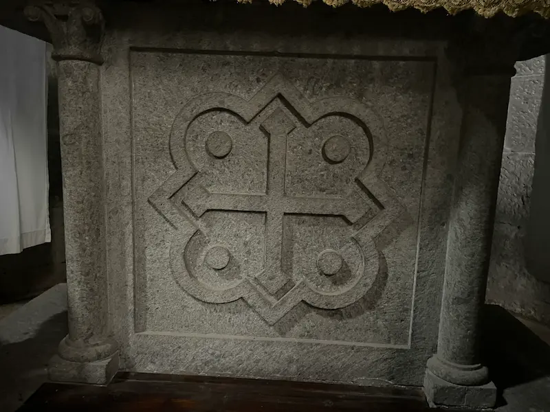 A side altar featuring a 4 dot cross inside Santa Maria Nuova, Viterbo